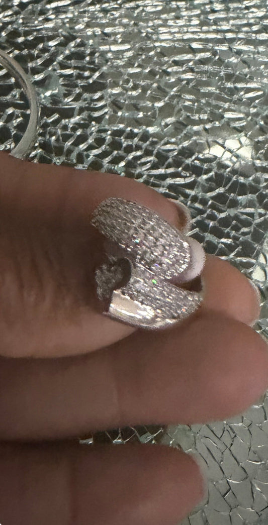 Matching silver sparkling crossover ring included in the two-piece set