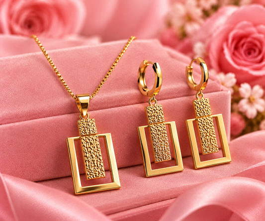 Illustrative styled gold earrings and pendant, display chain not included