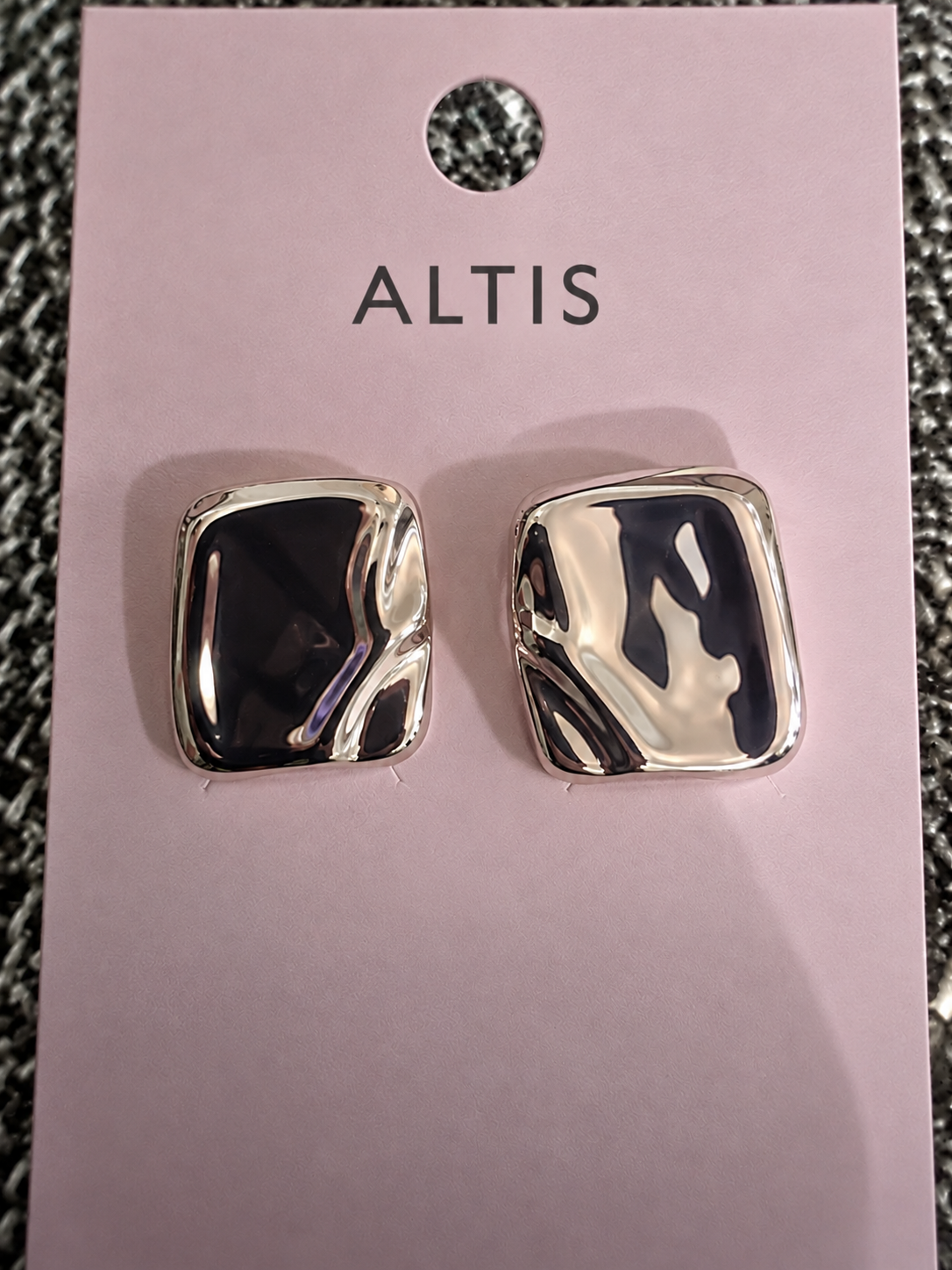 Alti's sculpted silver square statement earrings on branded pink card